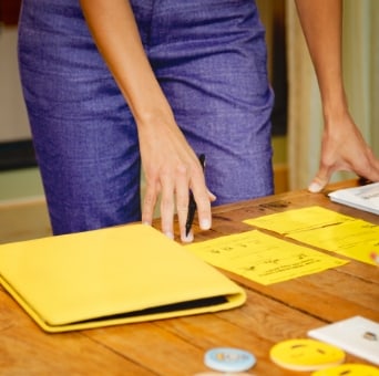 meeting table with a folder and papers