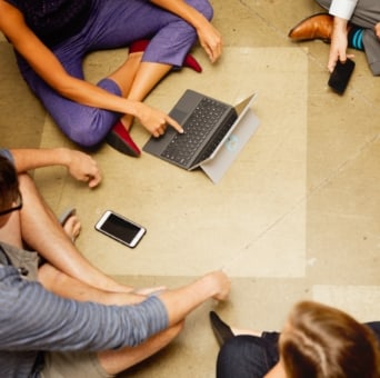 aerial view of team members sitting in a circle