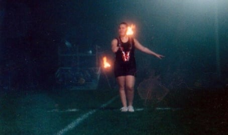 Kayleigh twirling fire baton